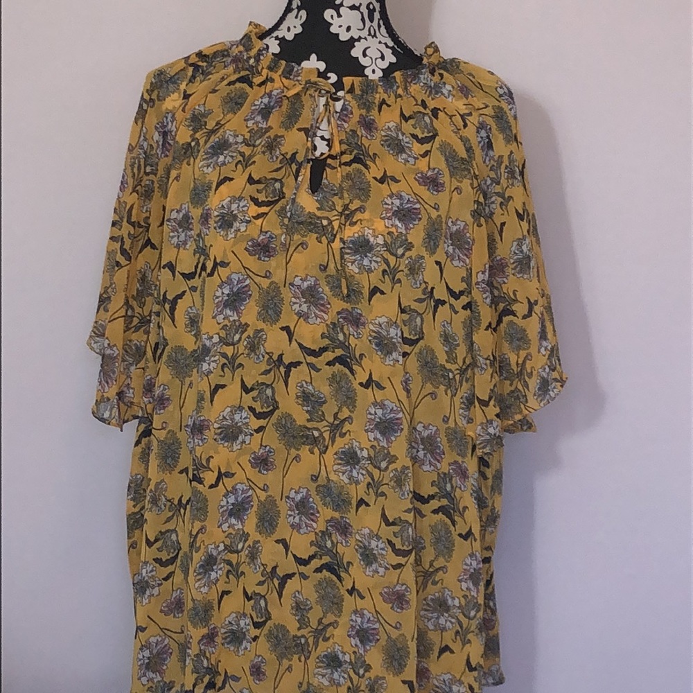 Airy lightweight brightly colored short sleeve blouse for spring and summer.